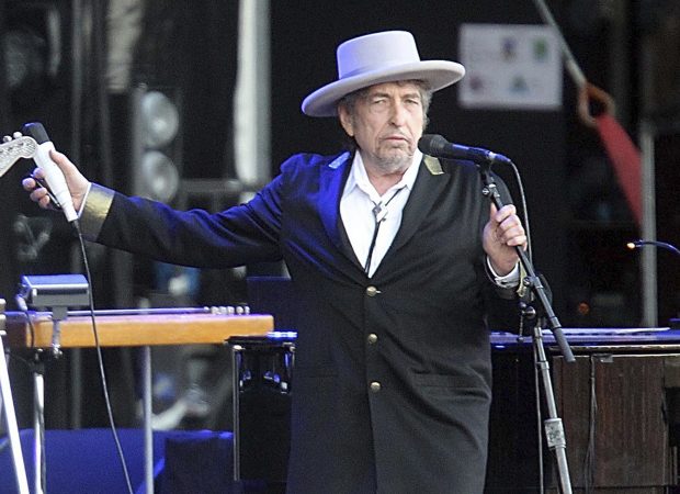 U.S. singer-songwriter Bob Dylan performing onstage at "Les Vieilles Charrues" Festival in Carhaix, western France. Dylan won the 2016 Nobel Prize in literature, announced Thursday, Oct. 13, 2016. (AP Photo/David Vincent, File)